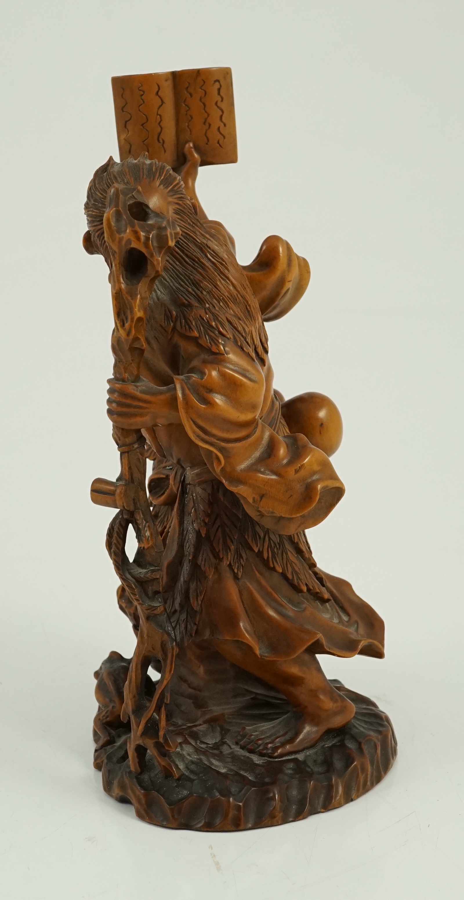 A Japanese boxwood okimono of Gama Sennin and two toads, 19th century, age crack to base